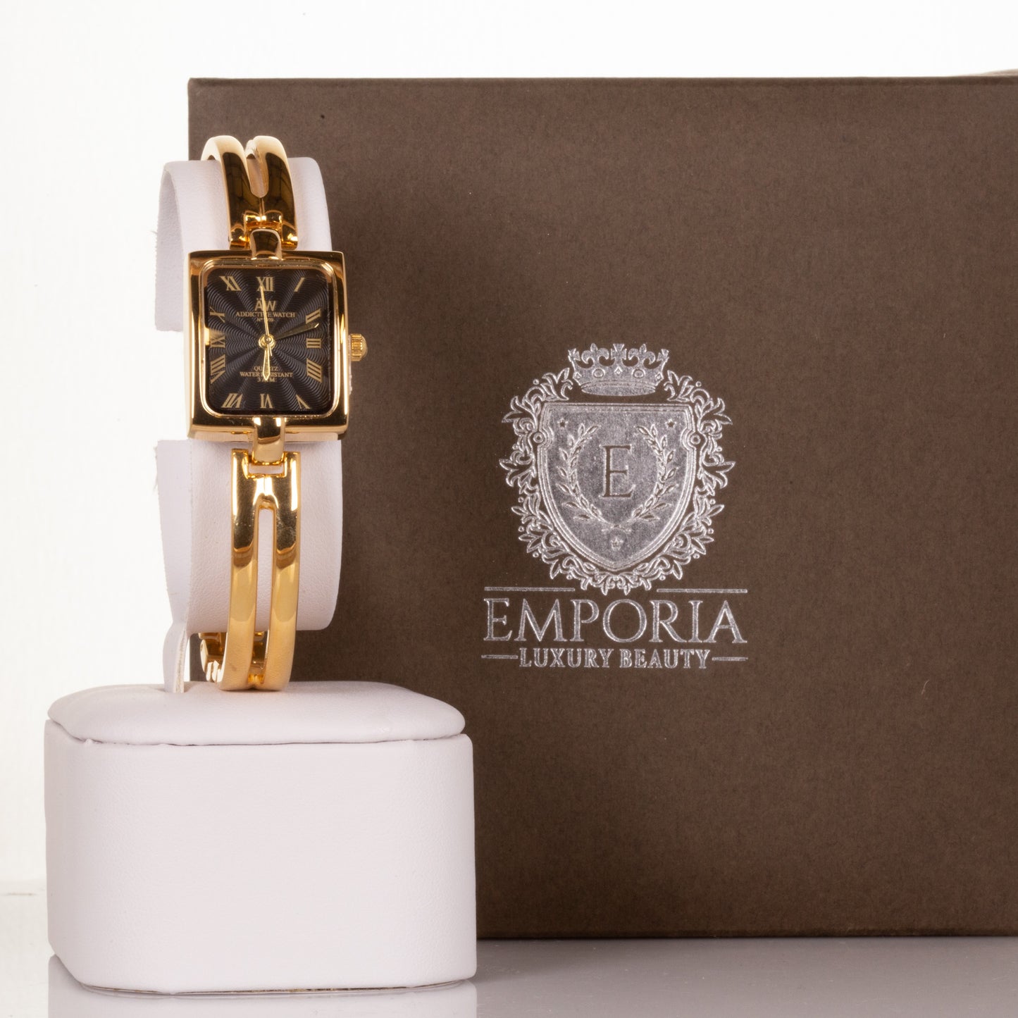 AW dámske hodinky vo farbe zlata s čiernym ciferníkom s rímskymi číslicami