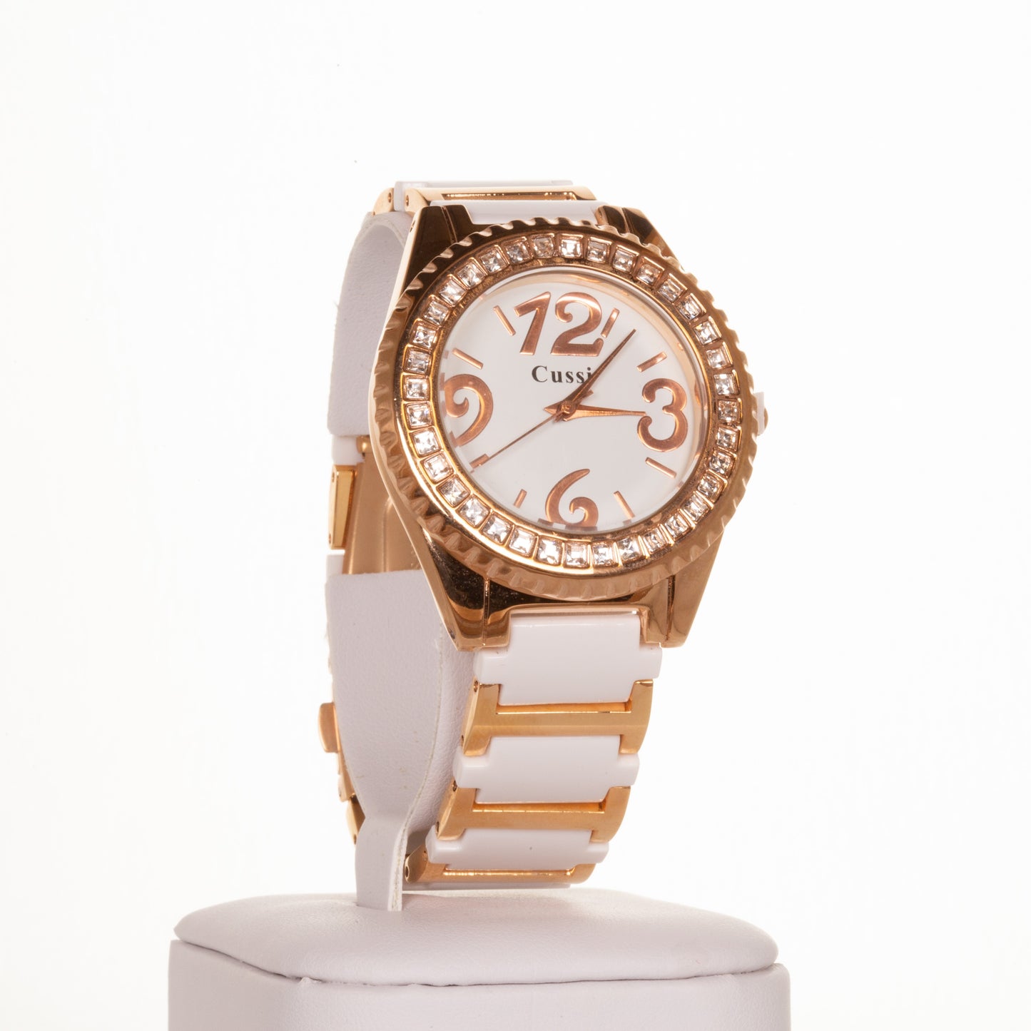 CUSSI dámske hodinky vo farbe ružového zlata s bielym remienkom a kryštálmi kremeňa okolo ciferníka